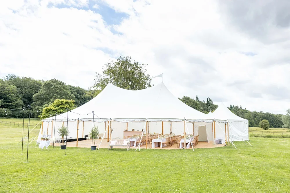 A traditional marquee in one of the rolling, open meadows on the West Barsham Estate