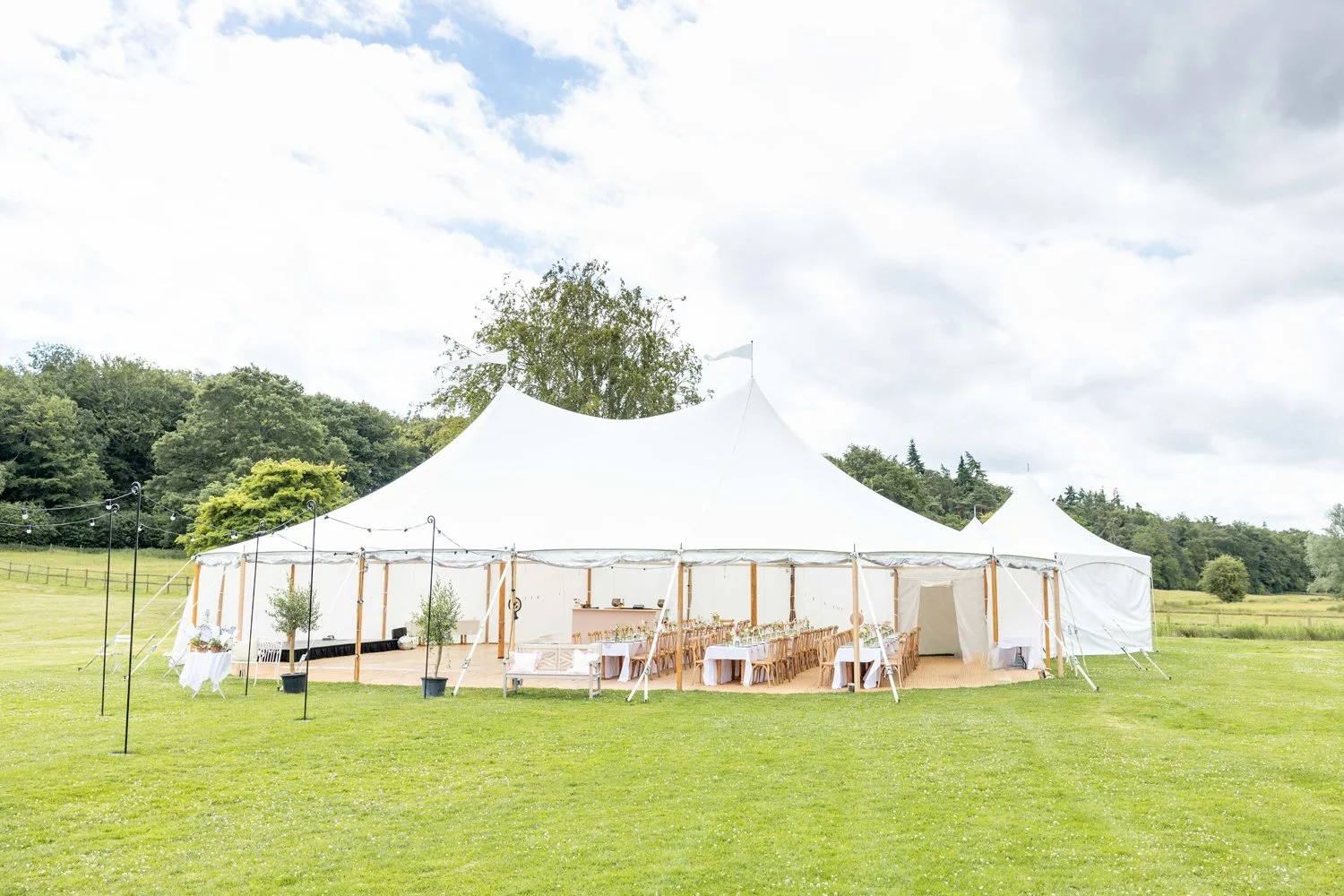 A traditional marquee in one of the rolling, open meadows on the West Barsham Estate