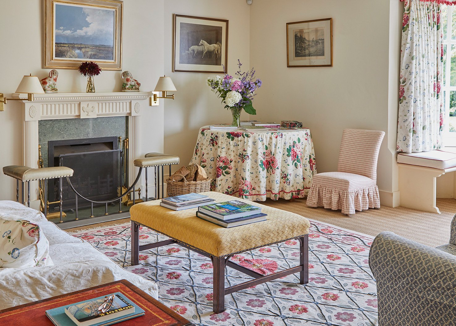The elegant sitting room at Meadow House with views out over the gardens