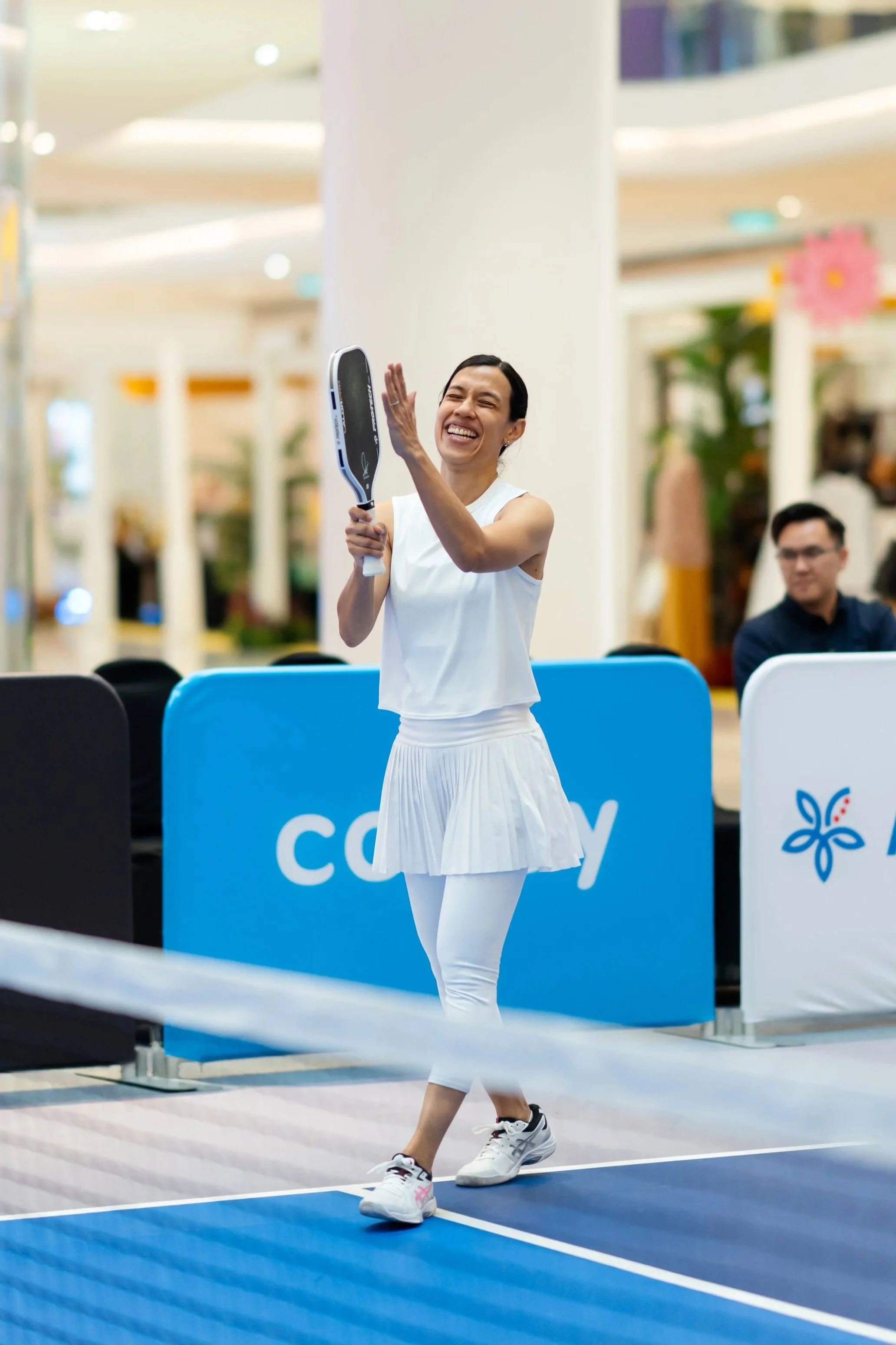 Nicol David cheering during pickleball match at sports & mental health summit