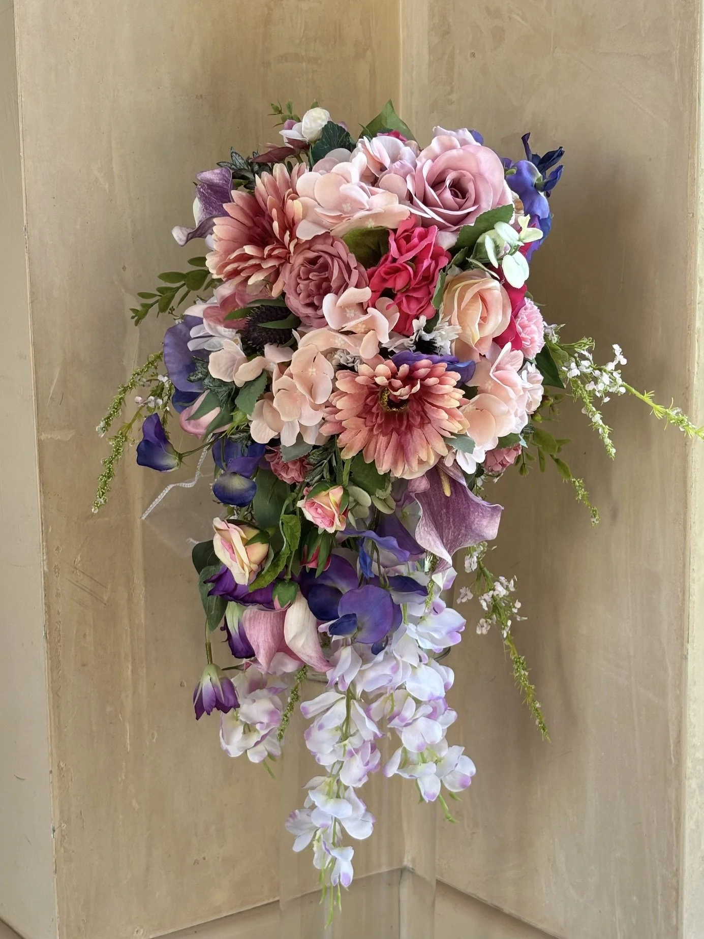 Bespoke cascading bouquet in purple and pinks