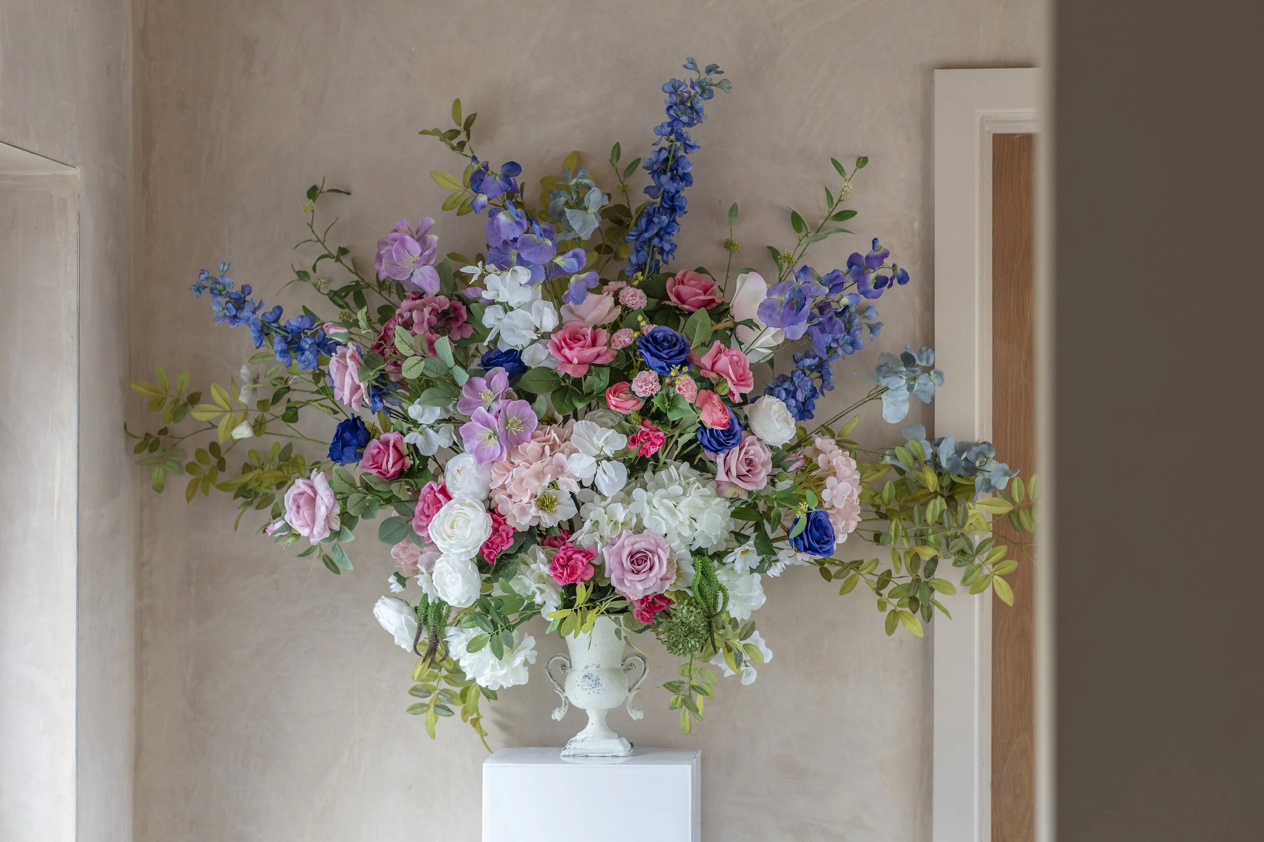 Totally bespoke extra large forward facing urn with indoor pillar