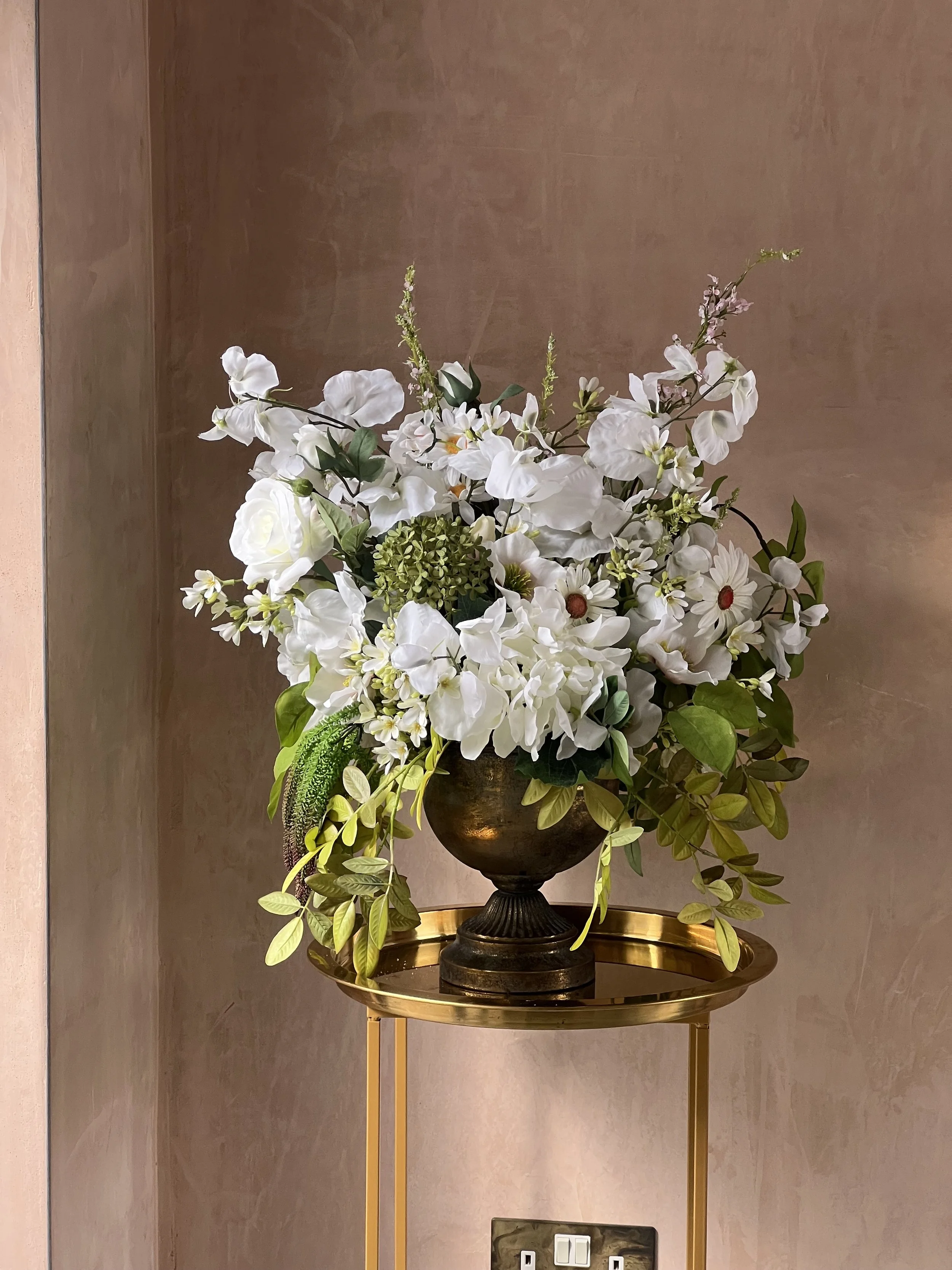 Wild white small urn on gold frame and gold plate