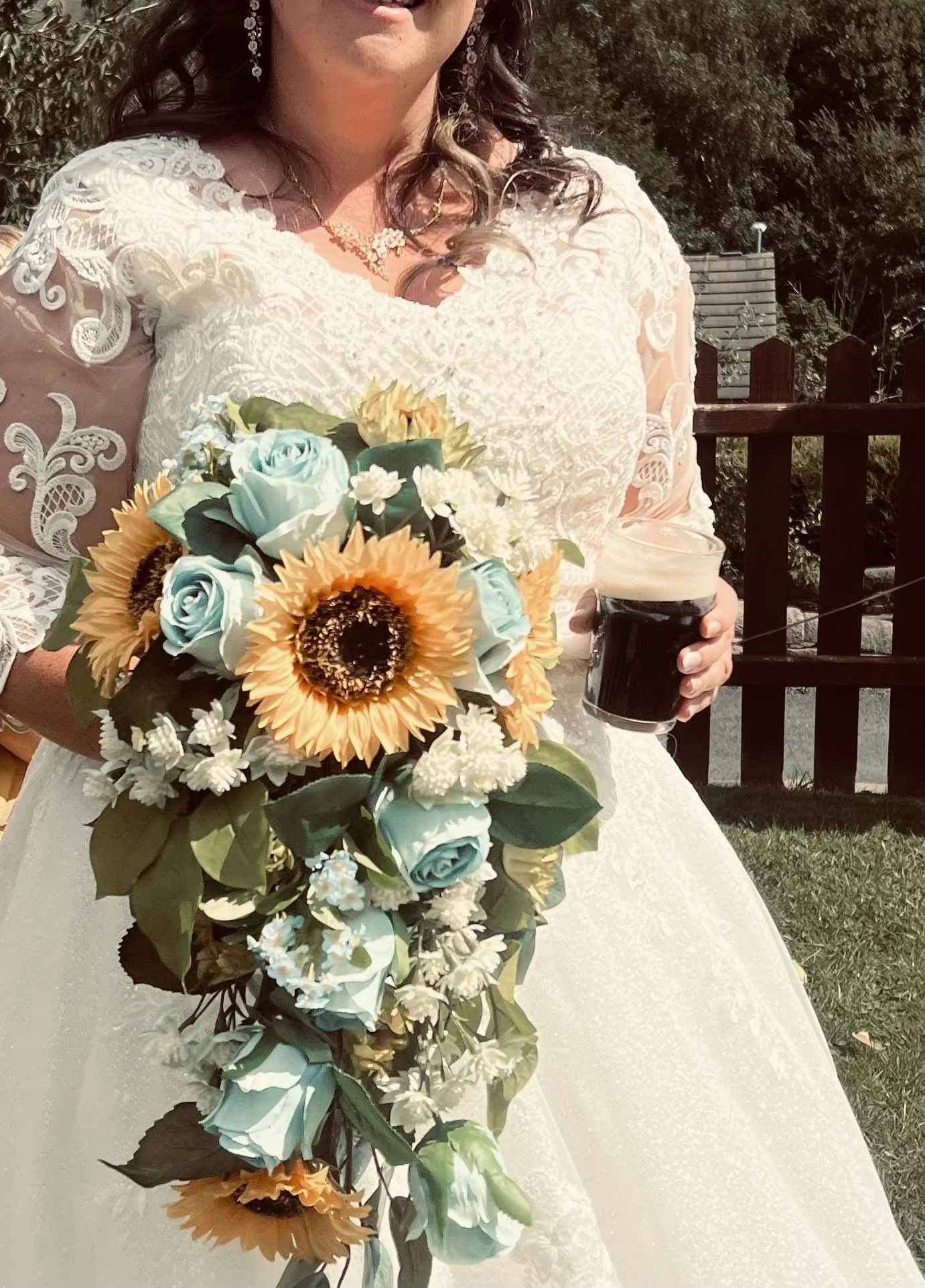 Sunflower and baby blue rose cascading bouquet