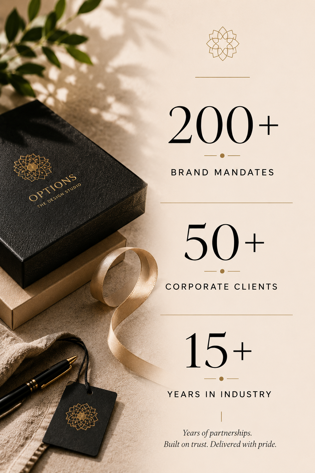 Poster with statistics about brand mandates, corporate clients, and industry years, next to a black box, beige box, pen, and ribbon.