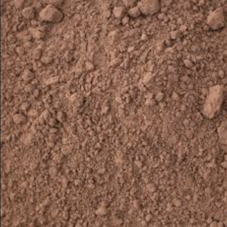 Close-up of reddish-brown dirt or soil.