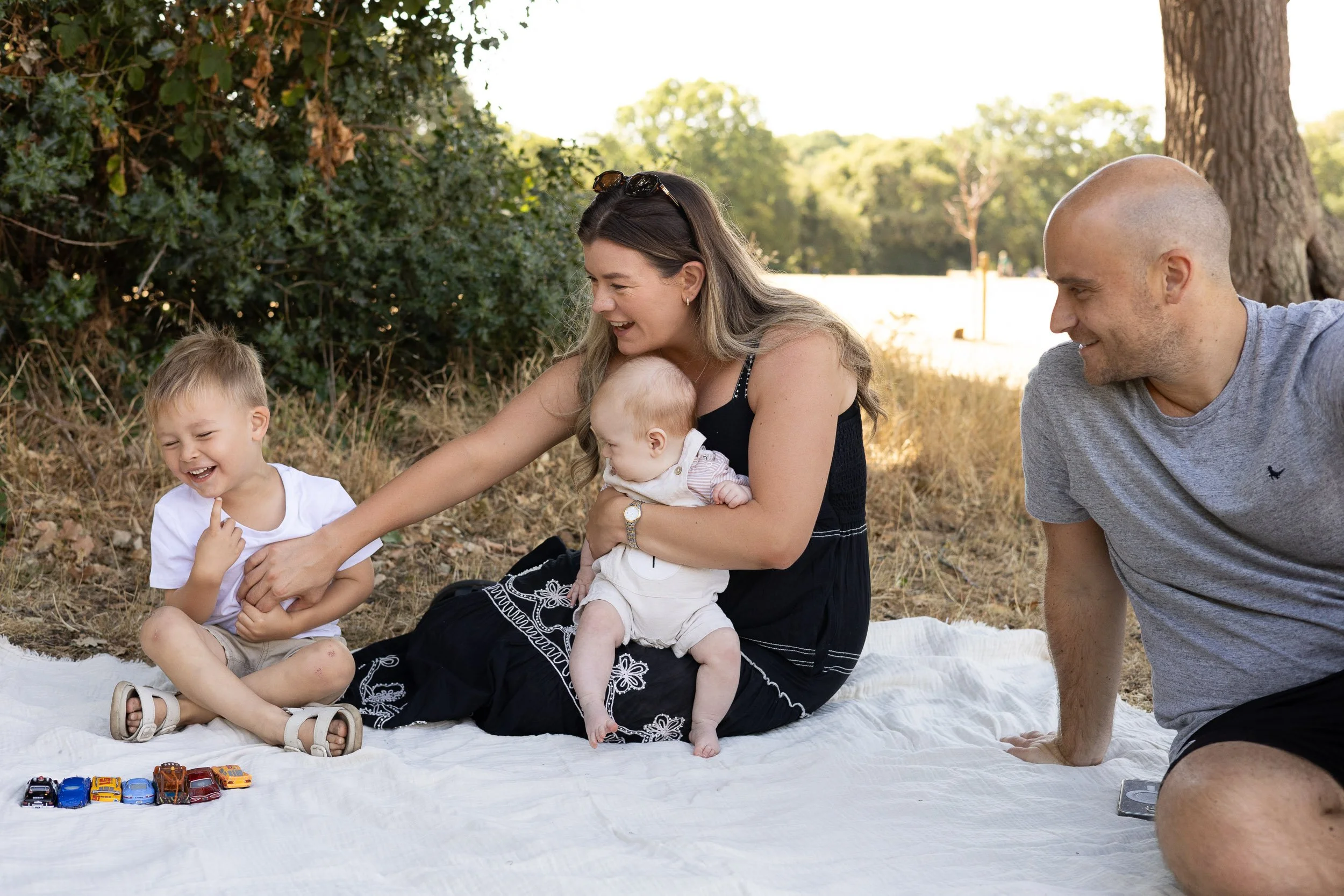 Family having a picnic and having a relaxed time together.