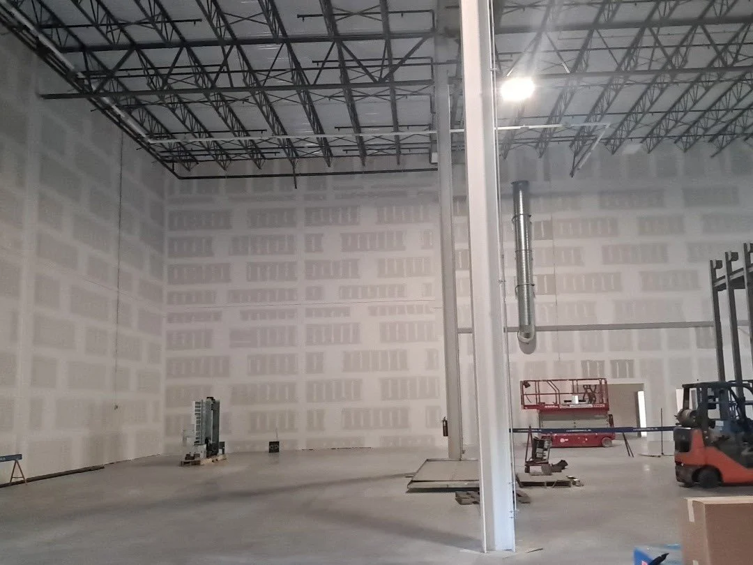Demising wall finish taped.