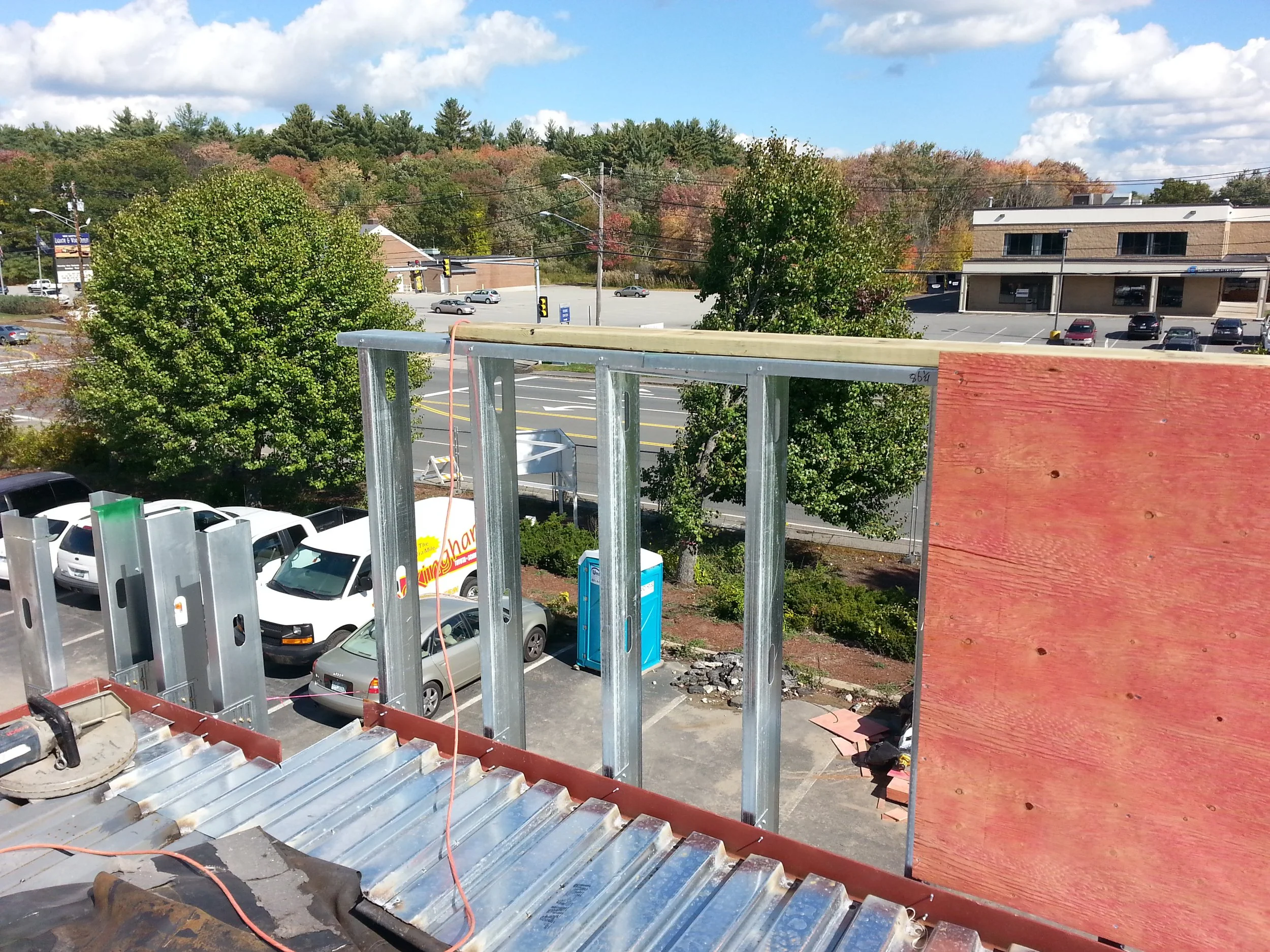 Parapet being framed and wrapped in plywood. 