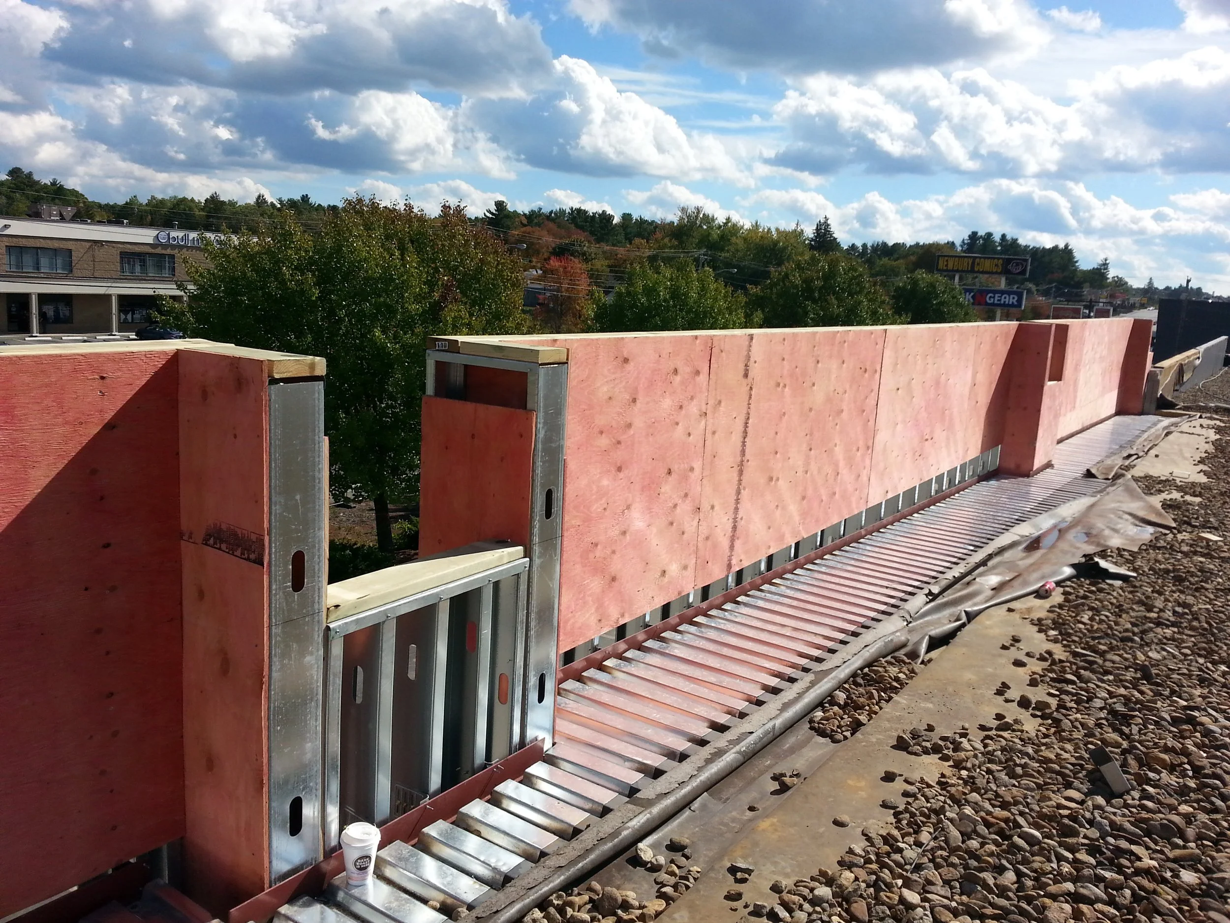 Parapet being framed and wrapped in plywood. 