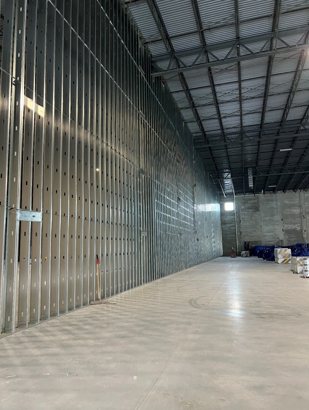 Interior light gage metal framed (LGMF) demising wall with 6" 18GA studs.