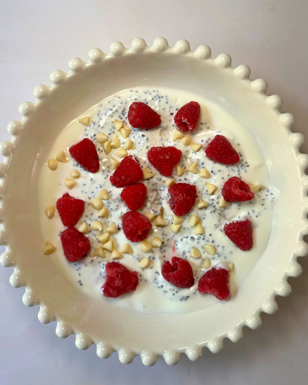 Raspberry + white chocolate chia yoghurt bowl