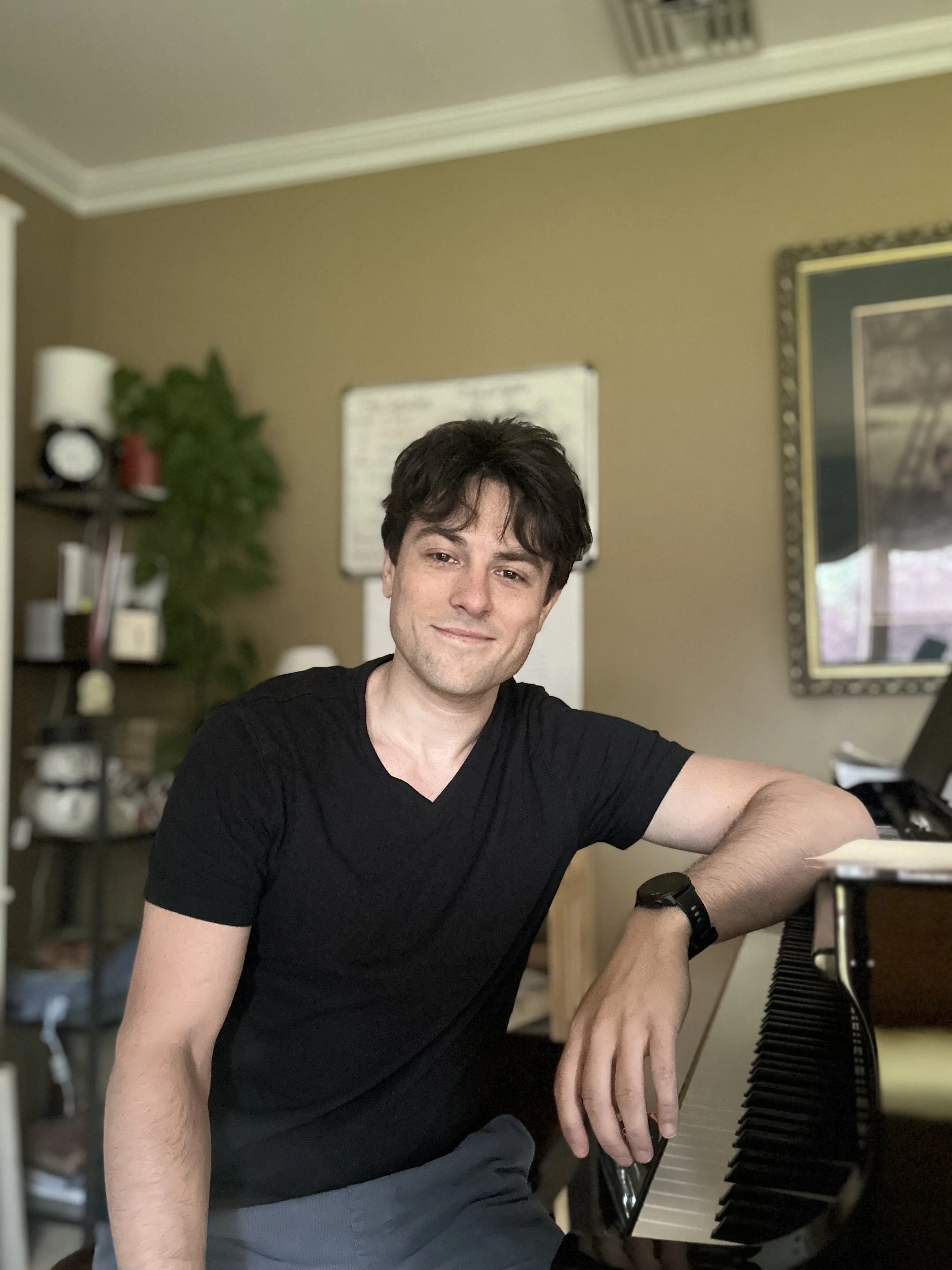 Andrew, sitting at his home Steinway baby grand