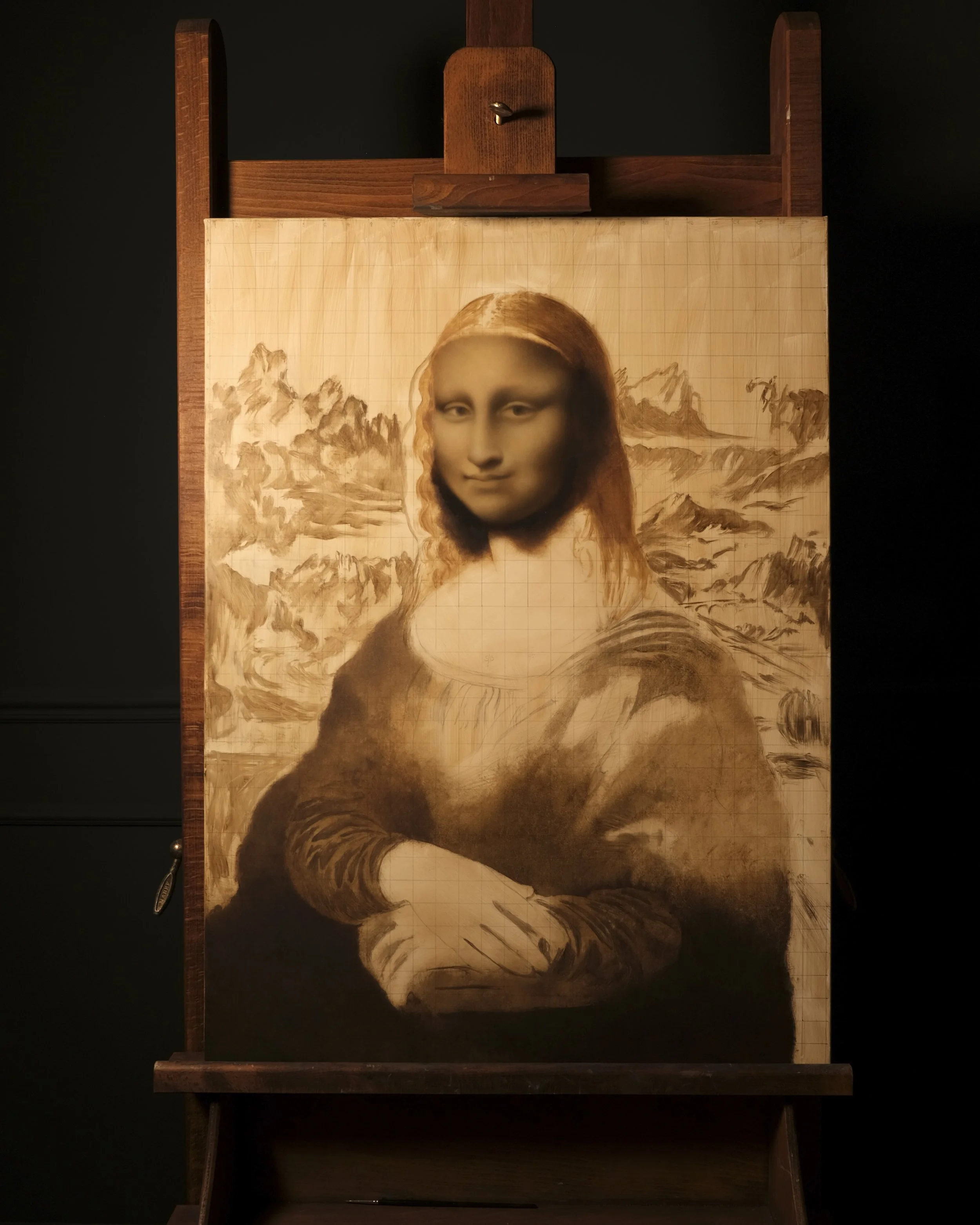 Oil painting work in progress by Anna Sumislawska depicting the Mona Lisa after Leonardo da Vinci on a wooden easel in a dark studio with deep green walls. The painting was created with oil paints on canvas using cruelty-free, vegan brushes.