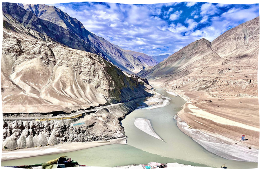 Mountain valley with a winding river representing movement, possibility, and a path toward healing