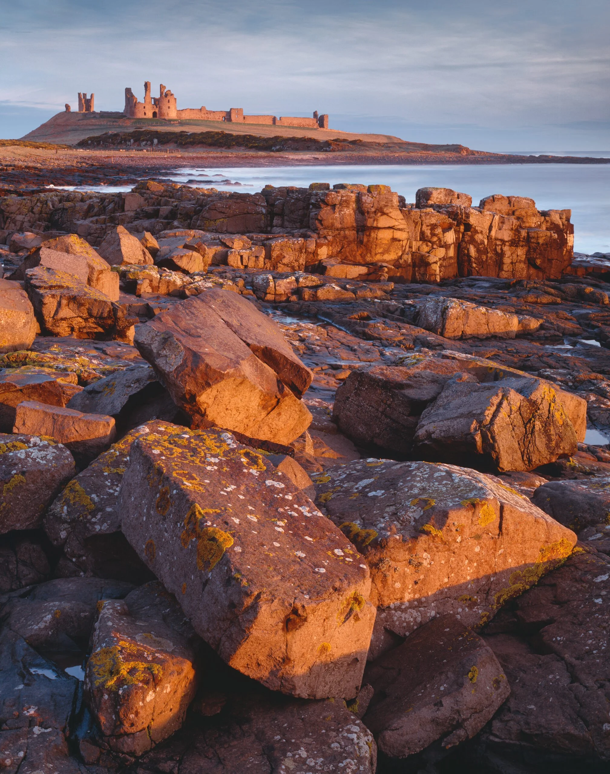 Dunstanburgh_RockofAges-scaled.jpg
