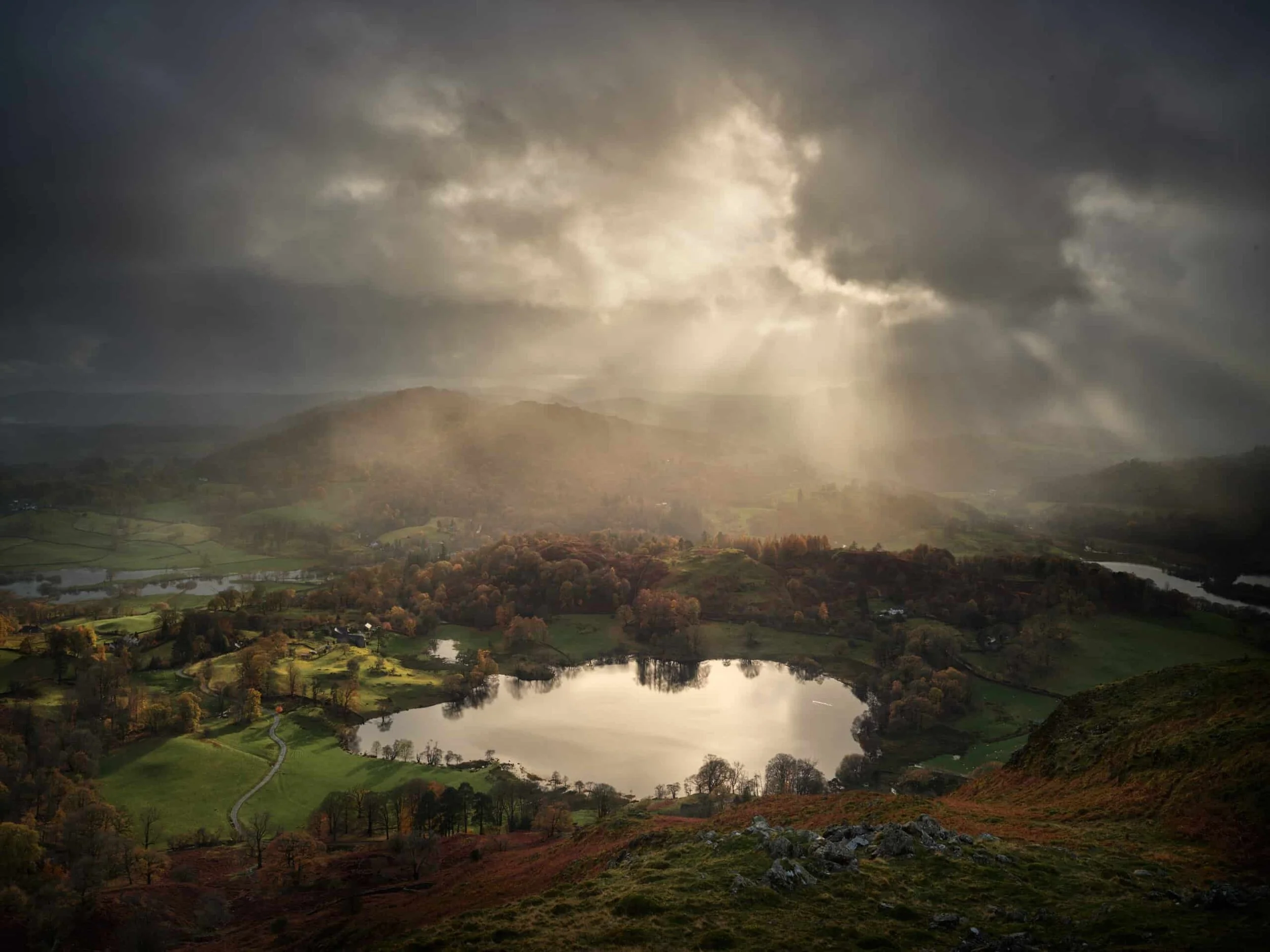 Sunburst-Loughrigg-Tarn-autumn-scaled.jpg