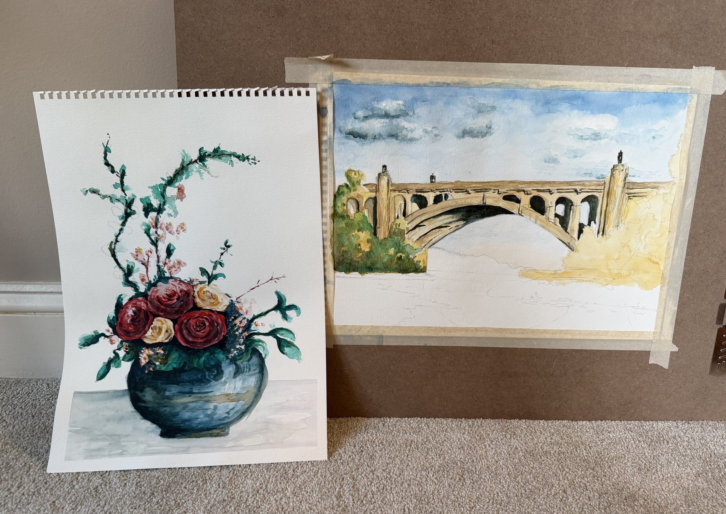 Watercolor paintings of a bunch of plants and an incomplete painting of a bridge