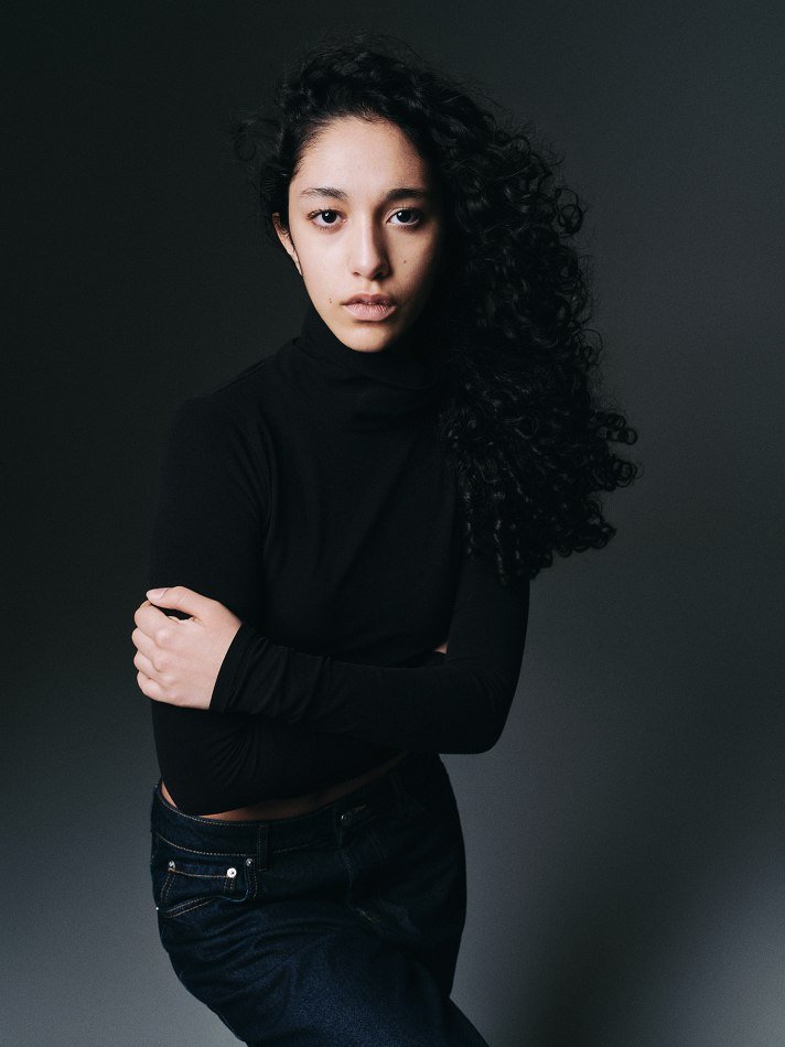 Main portfolio image of a female model from MTL Models MGMT, featuring a natural expression and clean lighting to highlight facial features and modelling potential.