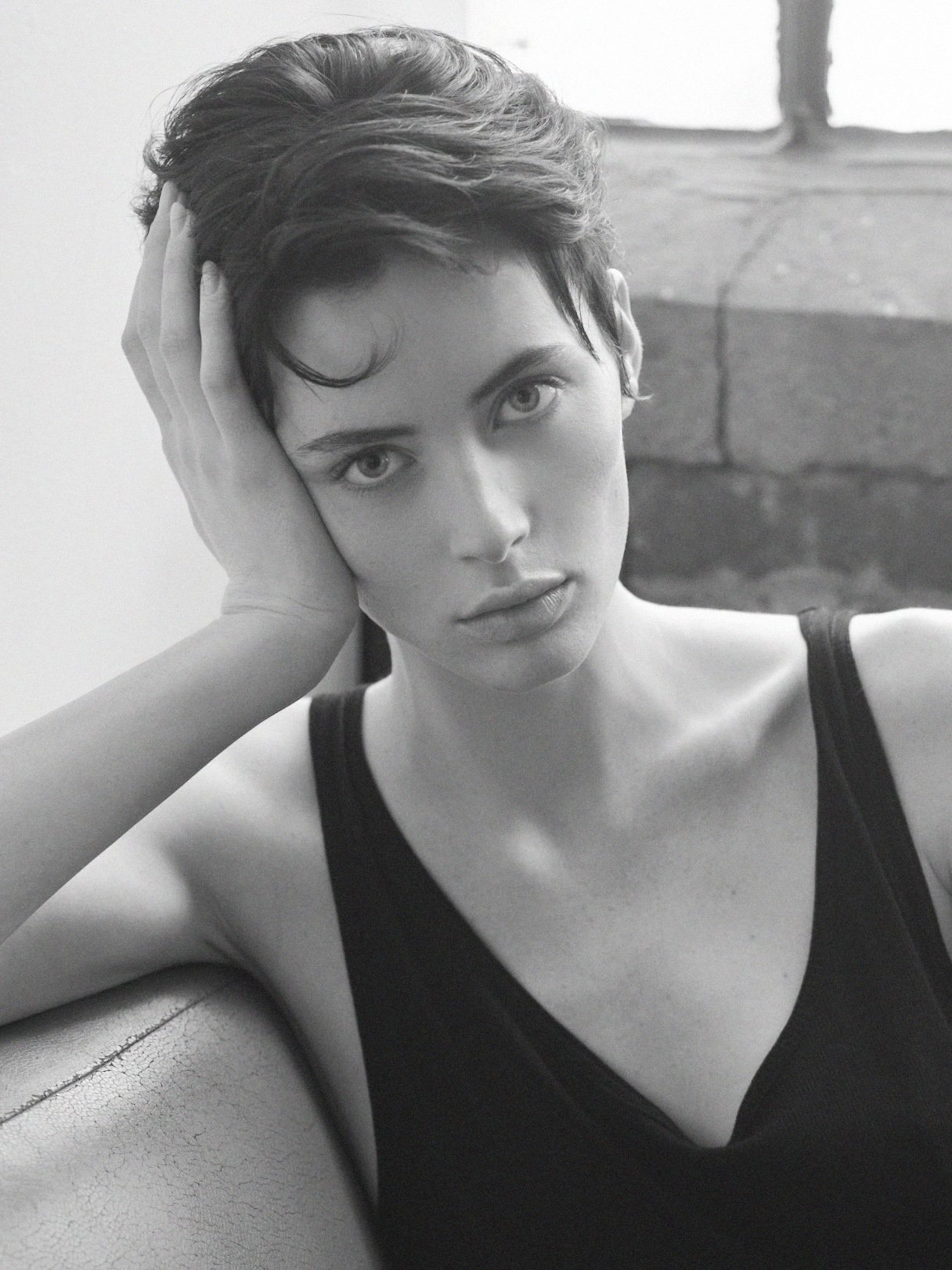 Striking black and white image of an emerging Montreal fashion model with strong editorial presence.