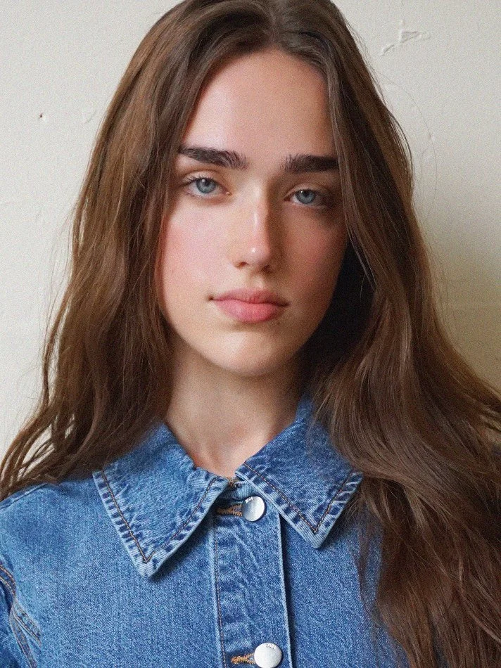 Main digital portfolio image of a MTL Models MGMT model, captured in natural lighting with minimal styling to show authentic look and physical features for scouting evaluation.