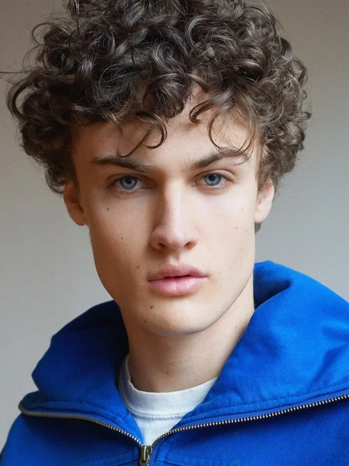 Main portfolio image of a male model from MTL Models MGMT, featuring a clean, professional composition that highlights natural features and strong on-camera presence.