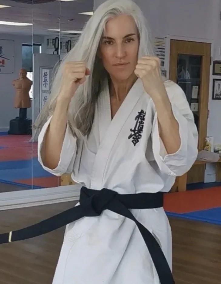 Silver hair Montreal model black belt in karate