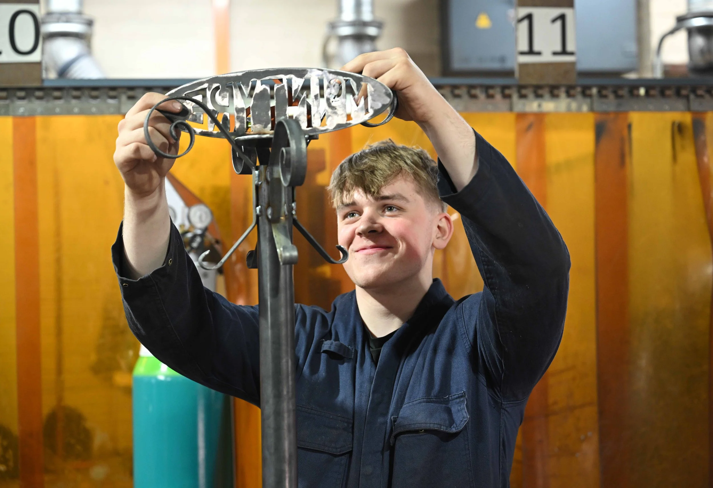 Higher Education Manufacturing student fitting work together.