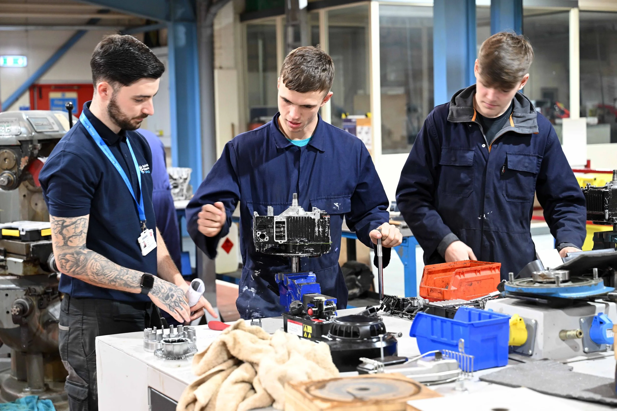 Students using engineering machinery in South West Durham Training workshops.