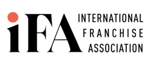 Logo of the International Franchise Association, featuring a stylized globe and the acronym "IFA" prominently displayed.
