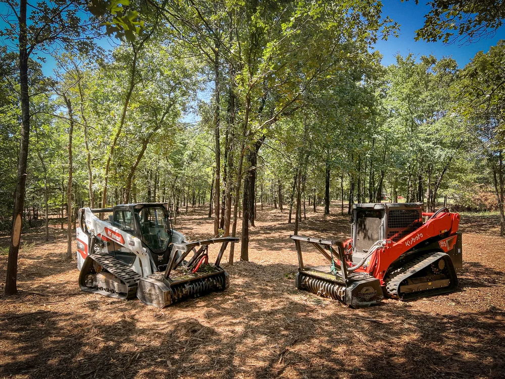 Skid steer forestry mulcher clearing flat Oklahoma land