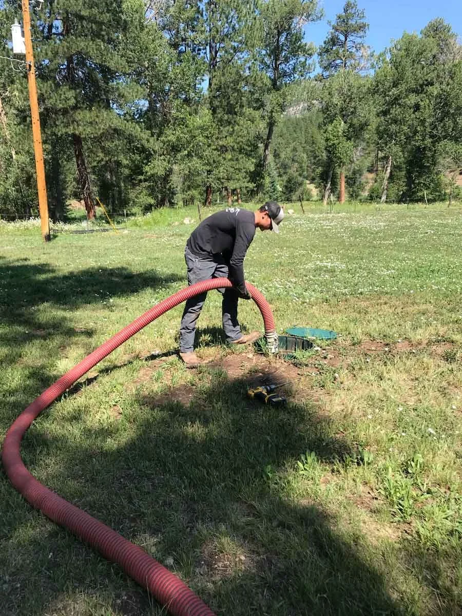 a man pumping a 1000 septic tank in Durango