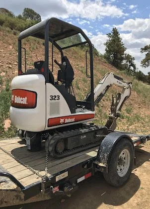 a bobcat mini excavator on scene providing Cortez septic services