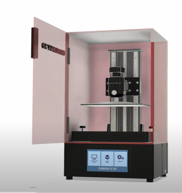 3D printer with open door displaying interior components