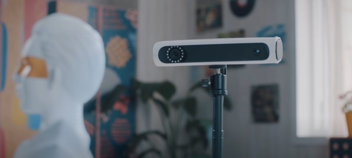 3D scanner with mannequin head in background