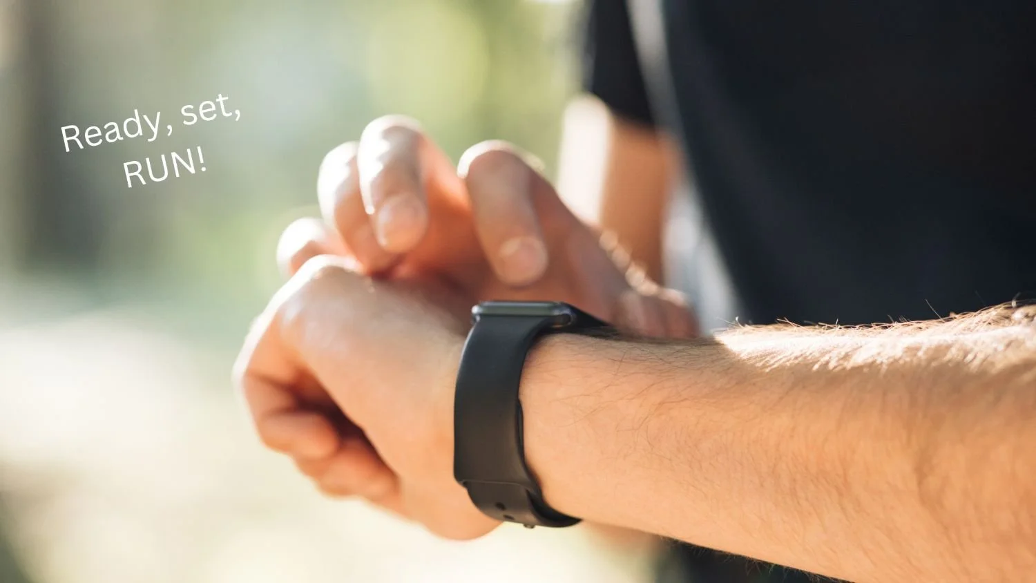 Runner checking GPS watch before starting a run