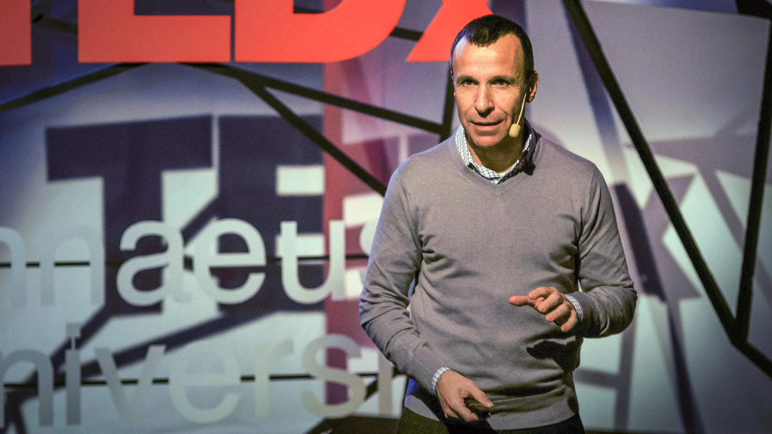 Guy Winch presenting a TED talk on emotional first aid.