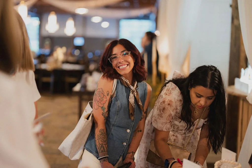 Women connecting at Highland Stables Social Club, a monthly girls night event series in Bowling Green, Kentucky focused on community and fun.