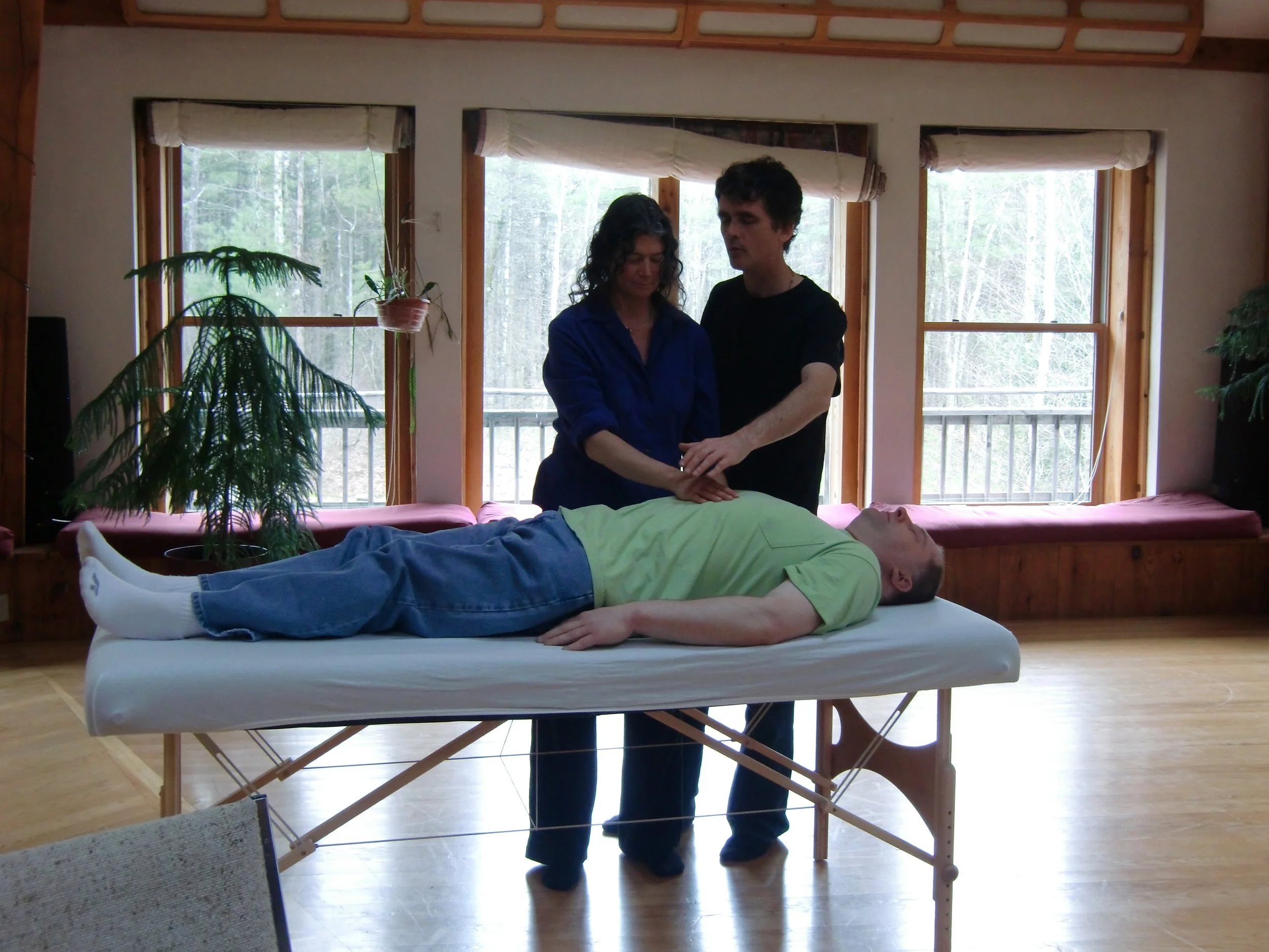Reverend Stephen Hermann engaged in hands-on healing.
