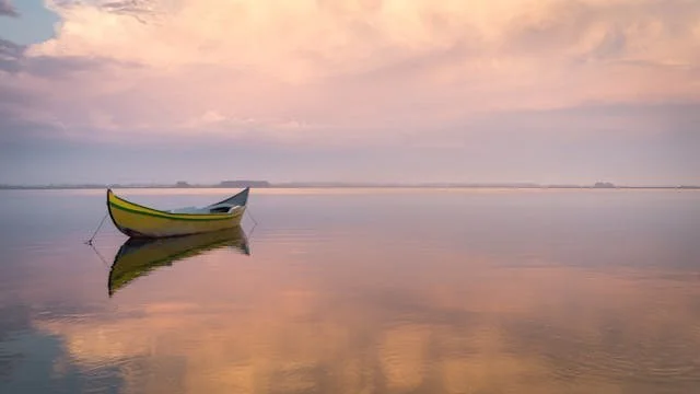 a boat alone in the water