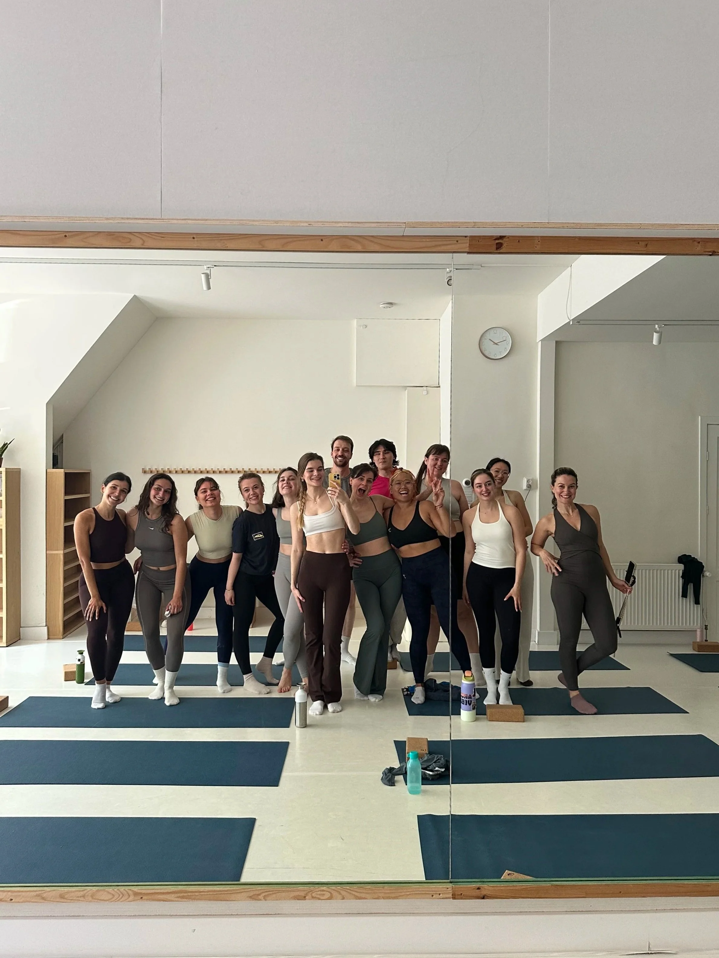 Women after a Mat Pilates class at Well.Daria in Amsterdam Oud-West.