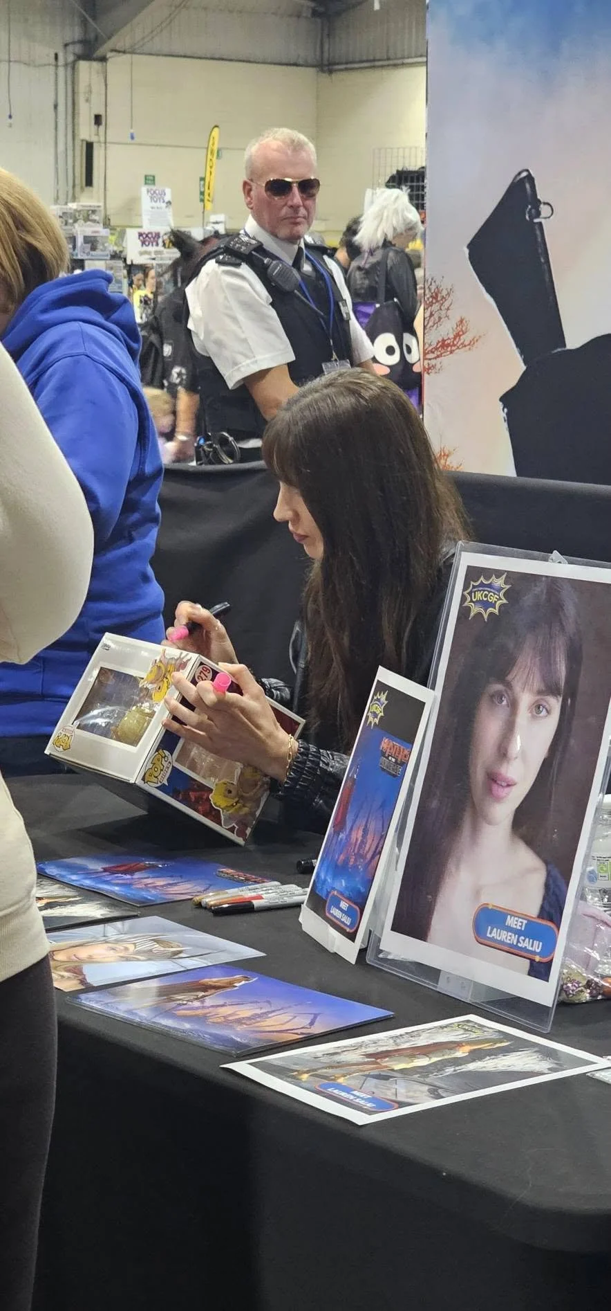 Lauren Saliu signing autographs at UKCGF in Exeter