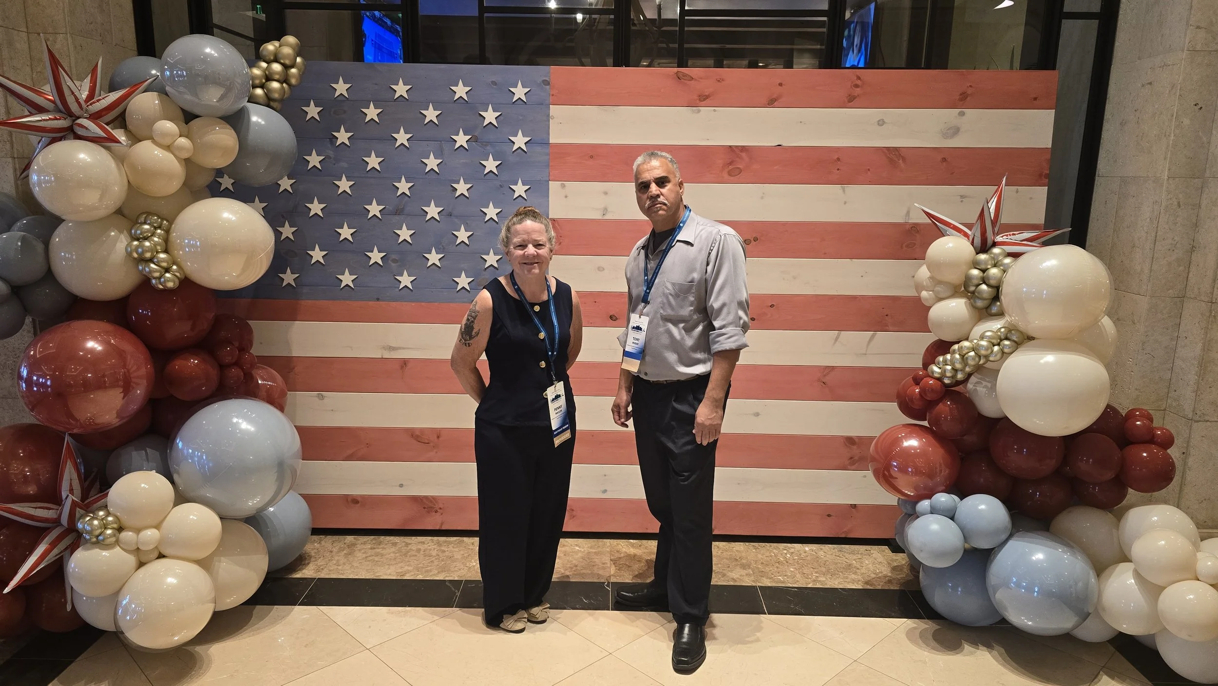 Penny and Tony, owners of veteran-owned Peninsula Care Shuttle, at Non‑Emergency Medical Transportation Accreditation Commission (NEMTAC) Conference 2026