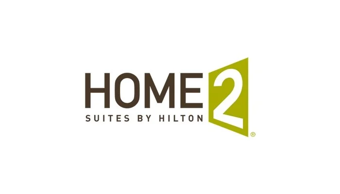 Logo for Home2 Suites by Hilton featuring the text 'HOME 2' with a green '2' inside a stylized arrow.