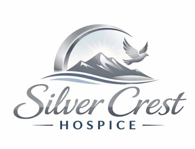 Logo for Silver Crest Hospice featuring a mountain, a sun, and a flying dove.