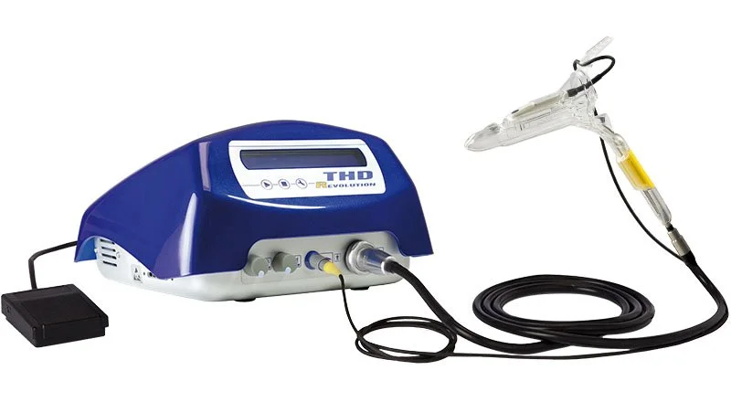 Medical device used for endoscopy procedures, featuring a blue control unit connected to a flexible tube and a clear scope with a yellow marking.
