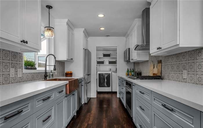 A sleek galley kitchen that proves smart storage and great style aren't mutually exclusive.