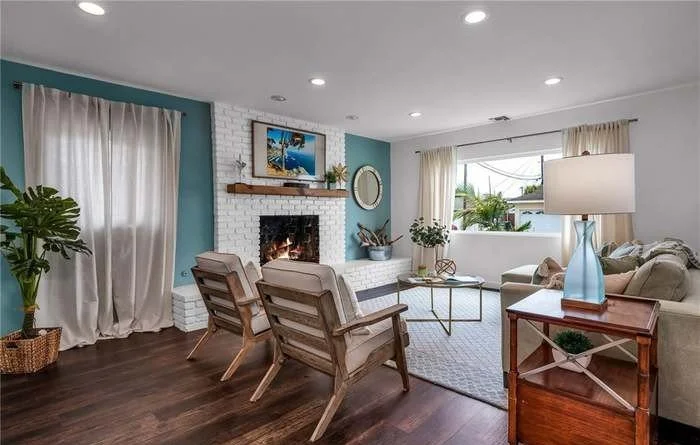 Reclaimed character meets vibrant personality in this updated living room — the perfect blend of lively and laid-back.
