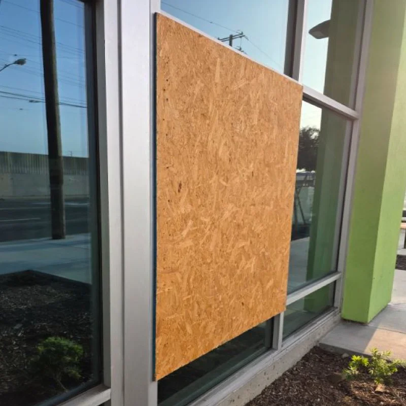 Emergency boarding-up window services for storefront or office building.
