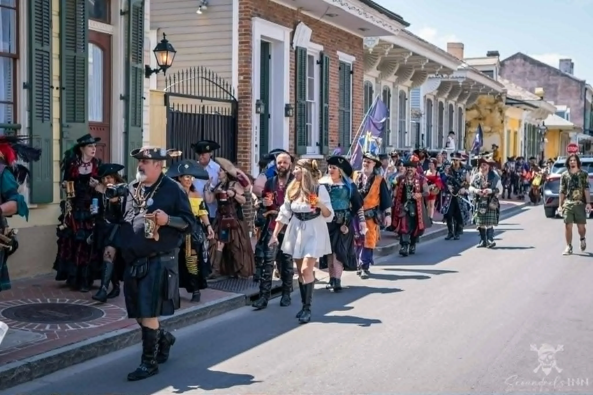 A group of people dressed as pirates walk through New Orleans' French Quarter on a pub crawl. Photo by Jack Gonzo / Scoundrel's Inn